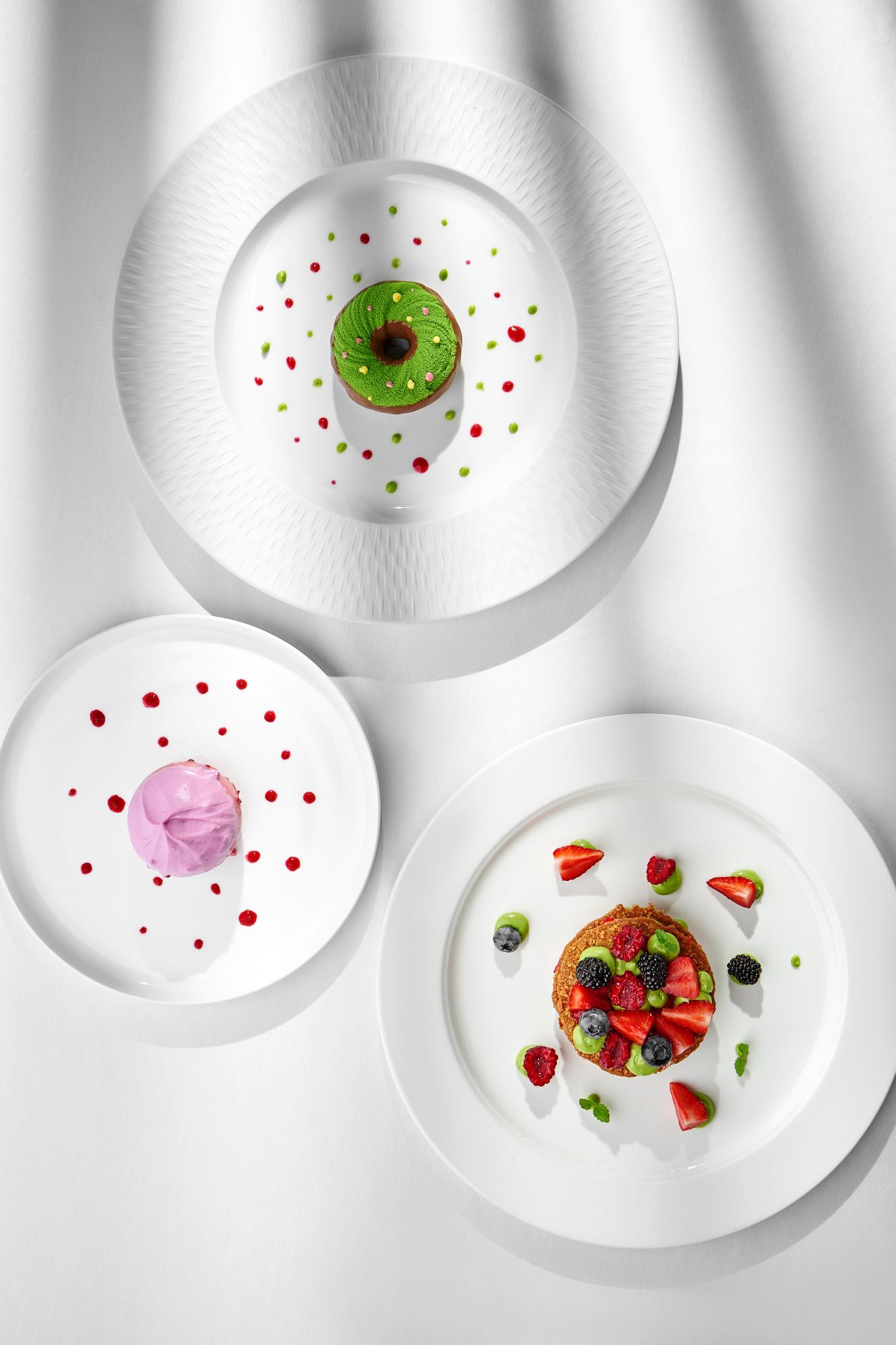 Bright studio counter with utensils and plated dish