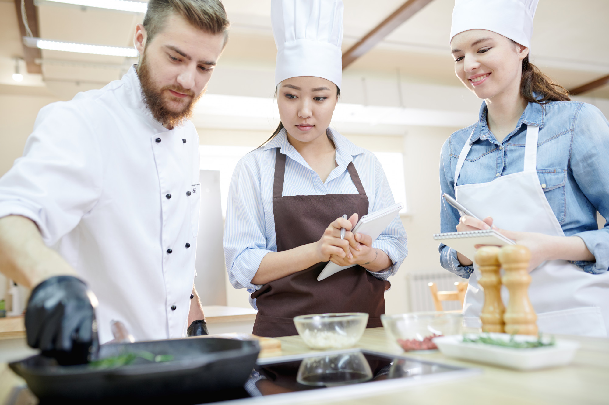 Students working at a shared chef station